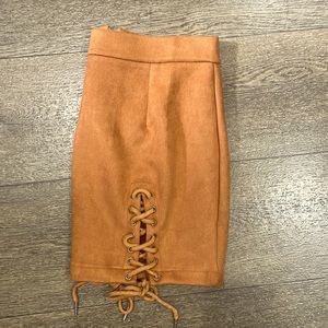 Brown faux leather skirt with ties.